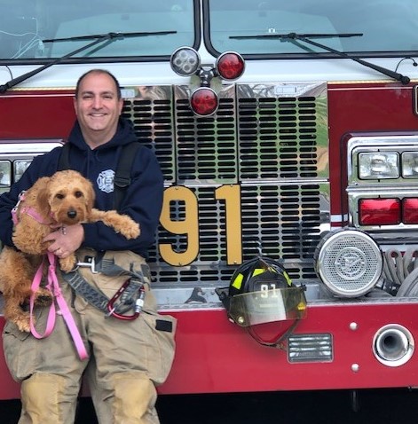 Photo of Steven Buonomo, CPA in front of fire truck